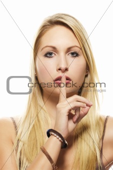 beautiful blonde woman holding finger at her mouth