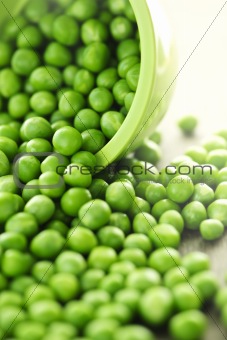 Spilled bowl of green peas