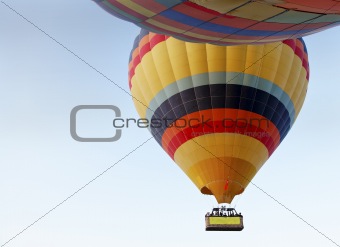 abstract two hot air balloons light blue sky