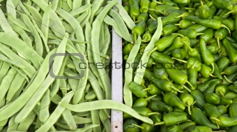 Pile of french beans and jalapeno peppers