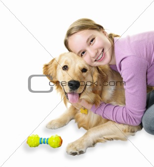 Girl hugging golden retriever dog