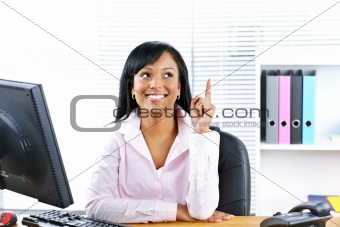 Businesswoman having idea at desk