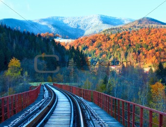 Railway on bridge and first autumn snow 