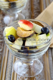 Glass bowl of fresh sweet fruit salad