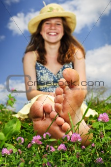 Young girl sitting on meadow