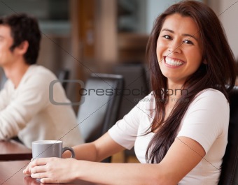 Happy woman having a coffee