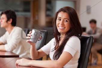 Cute woman having a coffee