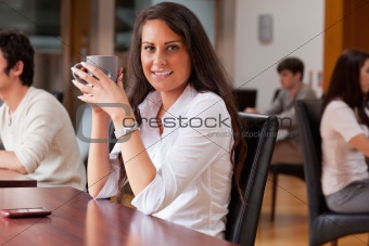 Young woman having a coffee