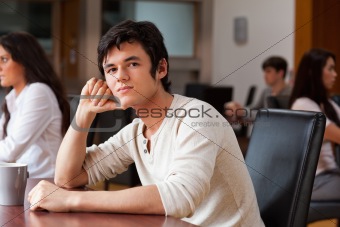 Young man sitting with a cup of tea