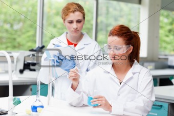 Young science students doing an experiment