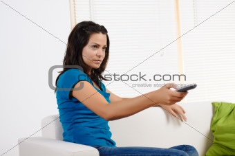 woman  using a television remote