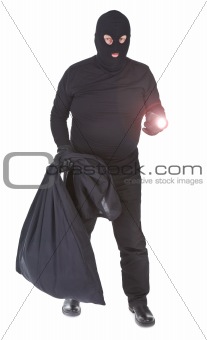 robber with flashlight and sack isolated