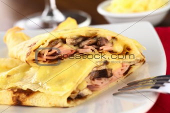 Crepes filled with ham, cheese and mushroom