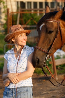 Woman looking to horse