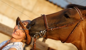 Horse try to eat a hat