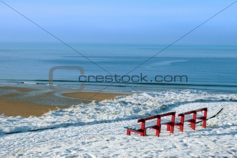 atlantic winter view and red benches