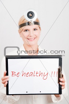 Beautiful female doctor giving health tips - be healthy text
