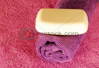 Soap bar on colorful towels