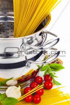Italian cooking / pasta, tomatoes, basil, garlic and saucepan