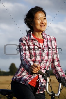 Woman in the park cycling