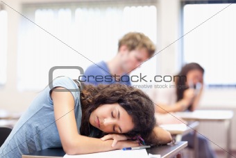 Student sleeping on her desk