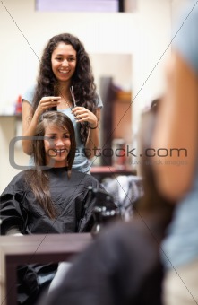 Portrait of a woman making a haircut