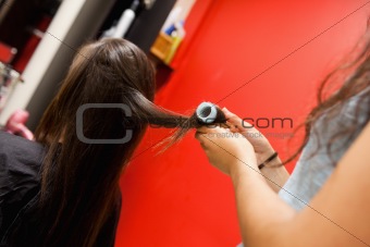 Hairdresser rolling hair