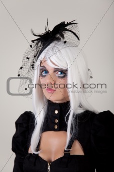 Fantasy girl with creative make-up and blue contact lenses 