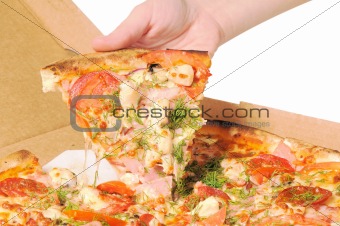 Pizza in a box and slice of pizza in hand
