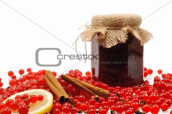 Jar of homemade red currant jam with fresh fruits