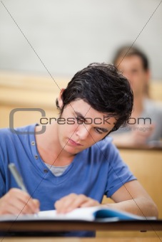 Portrait of a student taking notes