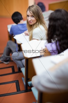Portrait of a young student being distracted