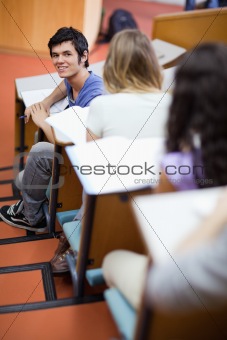 Portrait of a handsome student being distracted