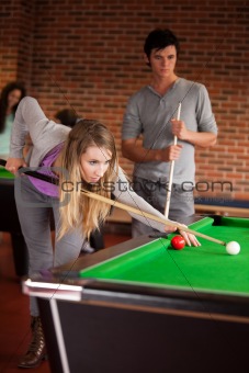 Portrait of friends playing snooker