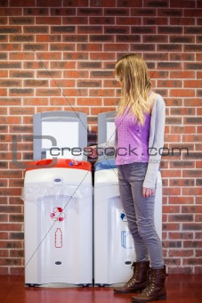 Cute woman recycling