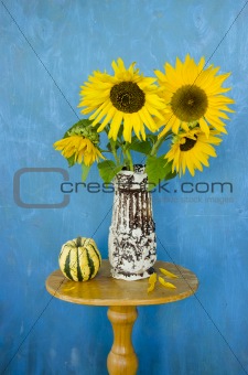 still-life with retro vase and sunflowers