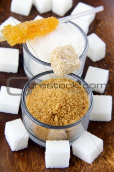 Several types of sugar - refined sugar, brown sugar and granulated sugar