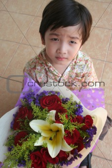 Boy holding bouquet