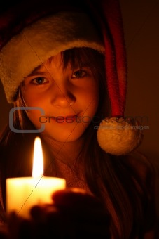 Girl with christmassy candle