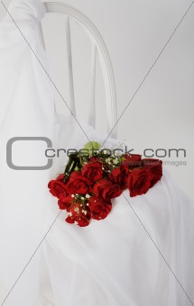 Red Roses On White Chair