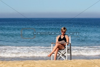 Woman reading on the beach