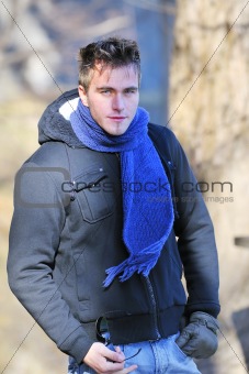 Young happy man with scarf