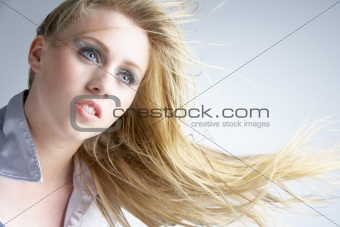 Young Woman With Hair Blowing Behind