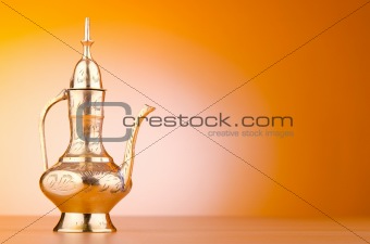 Ancient lamp against gradient background