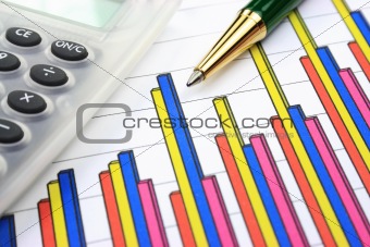 Business chart, calculator and pen
