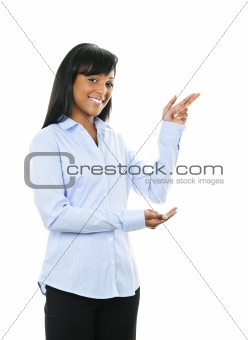 Smiling young woman pointing