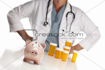 Doctor Wearing Stethoscope Behind Medicine Bottles and Piggy Bank.
