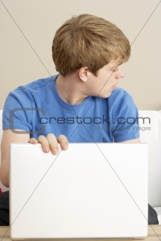 Worried Looking Boy Using Laptop