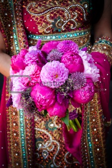 Indian brides hands holding bouquet
