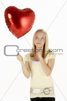 Teenage Girl Holding Heart-Shaped Balloon